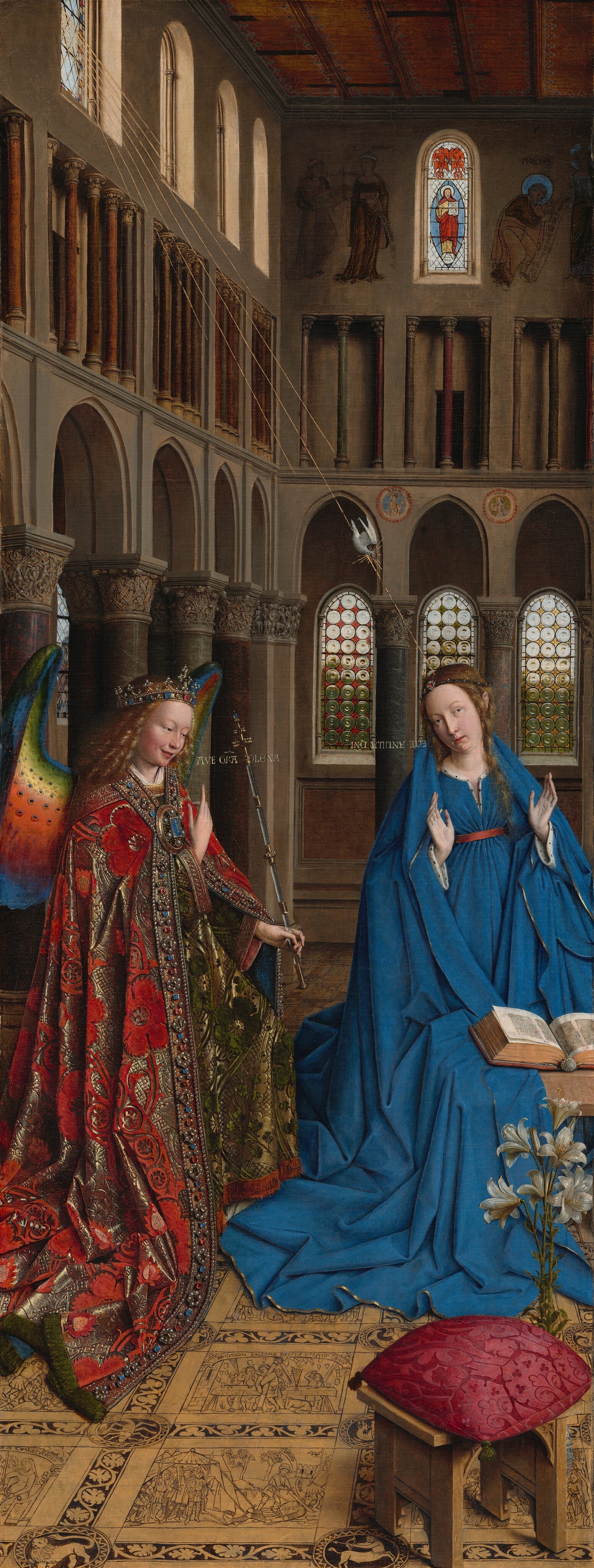 Jan van Eyck’s Annunciation, showing Gabriel and Mary inside a tall church with gold inscriptions and a patterned floor.