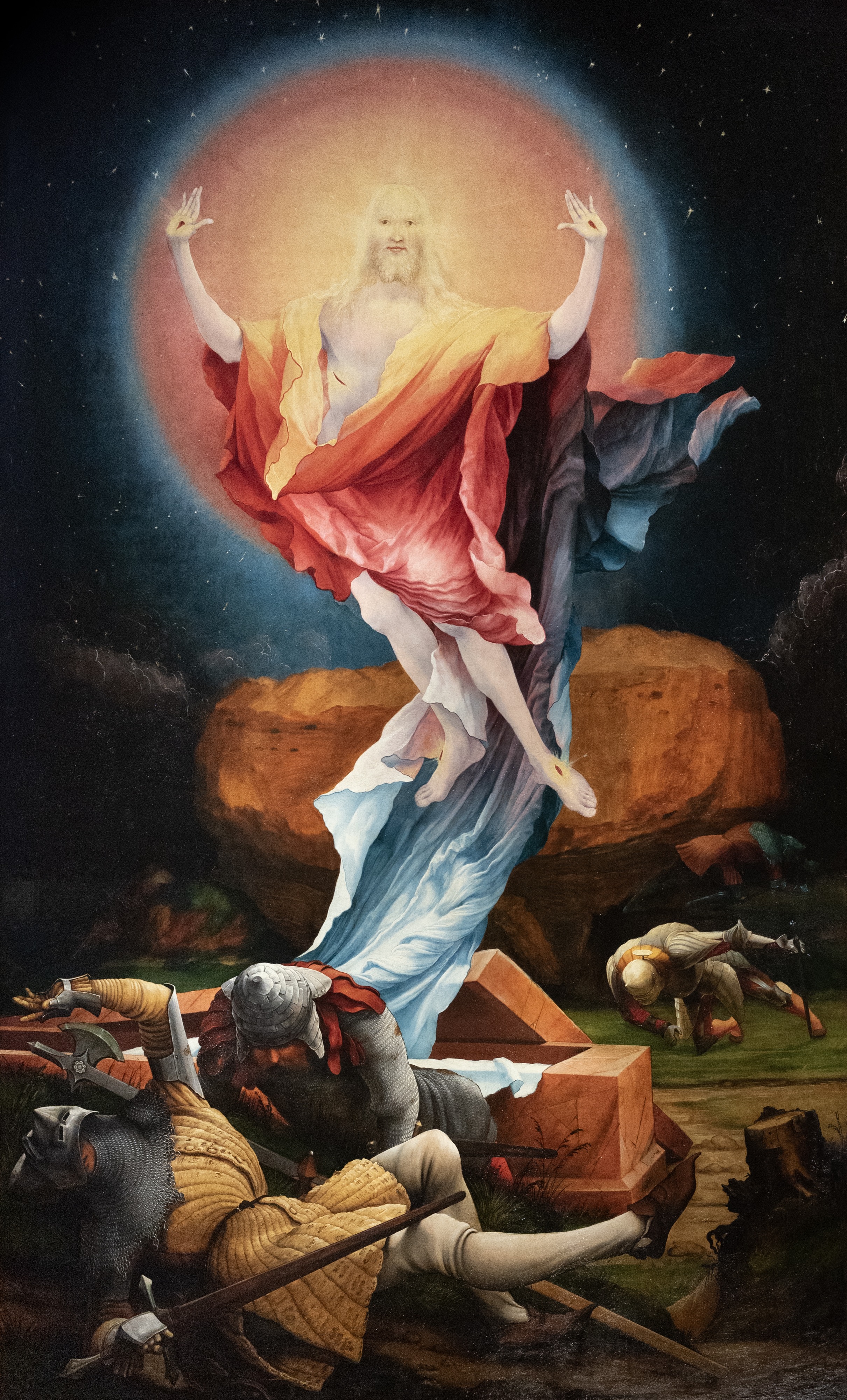 The Resurrection by Matthias Grünewald, from the Isenheim Altarpiece (1512–1516): the first Glorious Mystery of the Rosary, with the risen Jesus rising from the tomb in a globe of light above fallen guards.