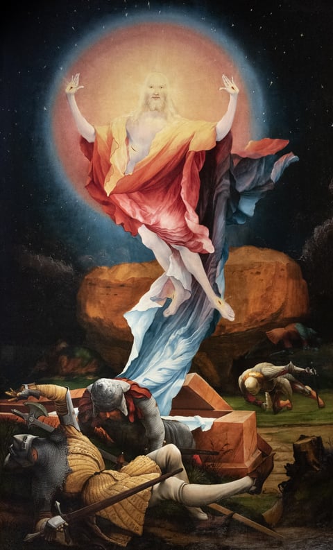 The Resurrection by Matthias Grünewald, from the Isenheim Altarpiece (1512–1516): the first Glorious Mystery of the Rosary, with the risen Jesus rising from the tomb in a globe of light above fallen guards.